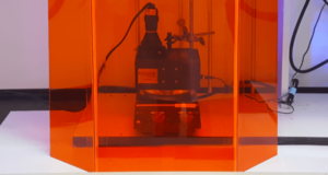 A picture of an orange screen with a photoreactor.