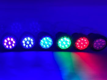 A row of lights that are lit up in different colors.