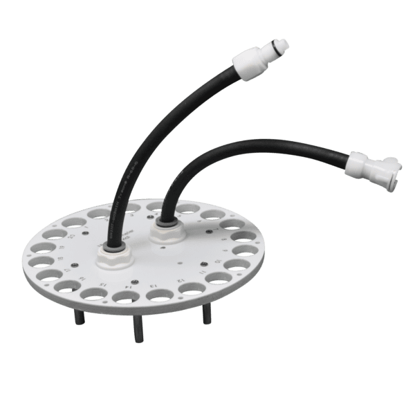 White circular plate with black tubes and connectors.