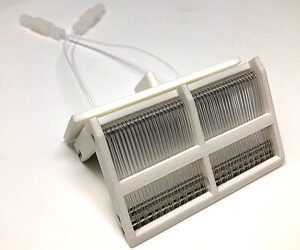 A white plastic holder with wires attached to it.